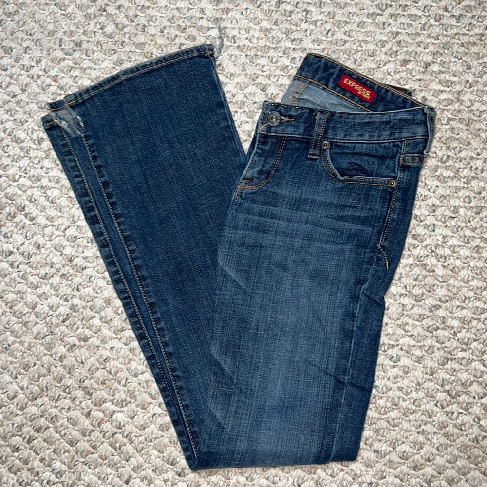 Express Stella Boot leg jeans 2L dark wash. Cut slits at bottom of jeans